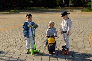 Three children playing geared in Molanizzi gears