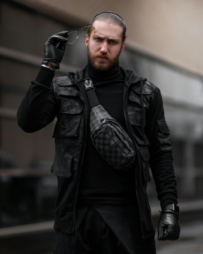 Man in tactical vest and urban shoulder bag