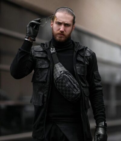 Man in tactical vest and urban shoulder bag