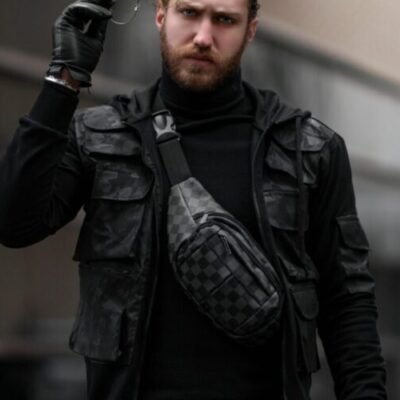 Man in tactical vest and urban shoulder bag