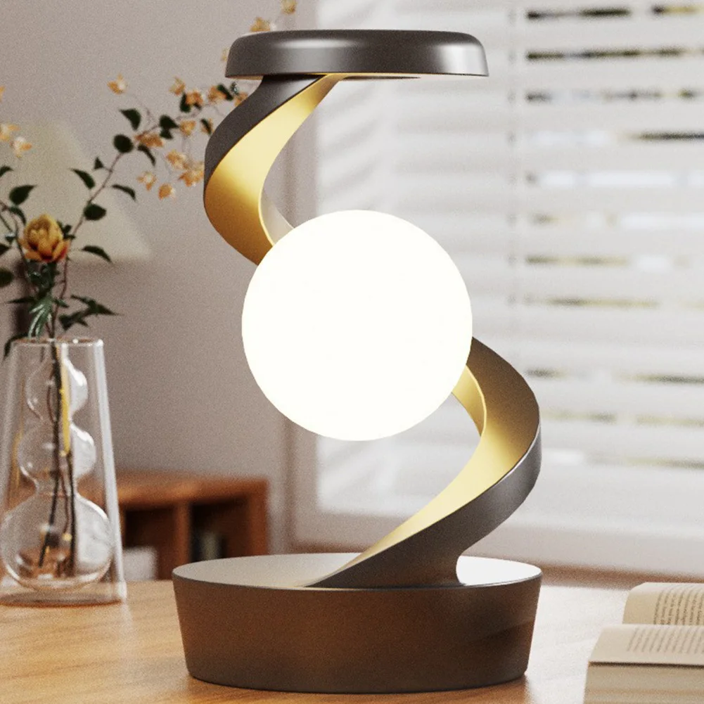 Molanizzi modern spiral desk lamp with a white sphere on a wooden table