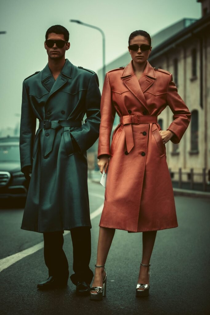 Fashion-forward models posing in coats on a city street, exuding modern style. Styles and Trends-Molanizzi
